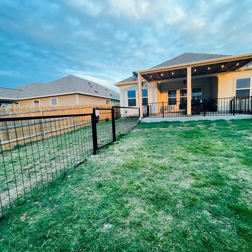 Metal wire fence with gate for pets